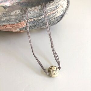 Minimalist floral bead necklace with gray silk cord